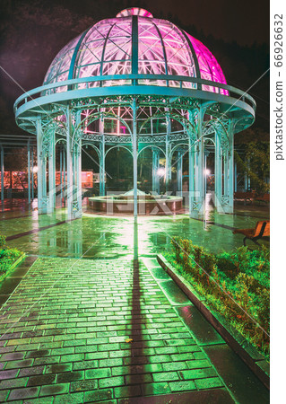 Borjomi, Samtskhe-Javakheti, Georgia. Pavilion Above Hot Spring Of Borjomi Mineral Water. Famous Local Landmark Is City Park At Autumn October Night In Illumination Lights 66926632