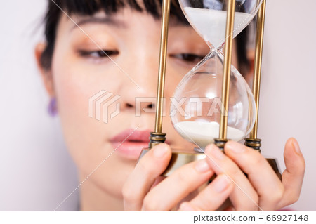 Woman and hourglass Woman and hourglass 66927148
