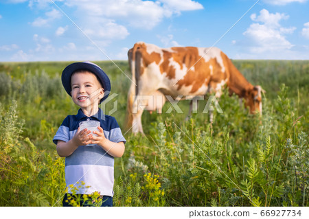 little boy drinking yogurt outdoors little boy drinking yogurt outdoors 66927734
