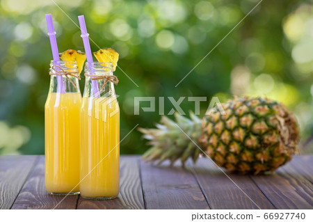 pineapple cocktail in glass bottles pineapple cocktail in glass bottles 66927740
