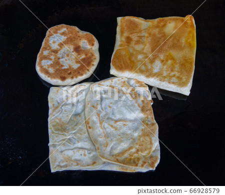 Roti Canai is famous Malaysian food. Roti Canai is famous Malaysian food. 66928579