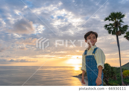 .Action boys take pictures during sunset at .Action boys take pictures during sunset at 66930111