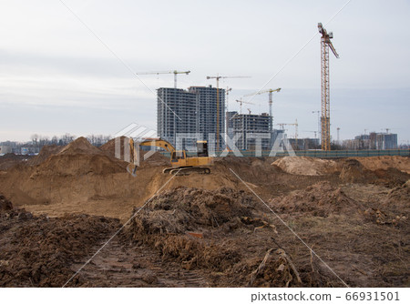 Excavator during groundwork on construction site. 66931501