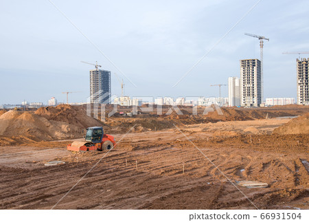 Vibration single-cylinder road roller leveling the ground for the foundation. Soil Compactor Vibration single-cylinder road roller leveling the ground for the foundation. Soil Compactor 66931504