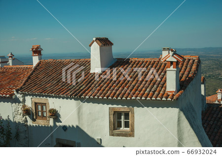 Chimneys over rooftop of an old house in Marvao 66932024