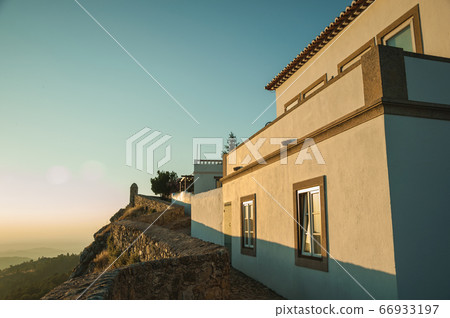 Stone wall and old house over rocky cliff in Marvao Stone wall and old house over rocky cliff in Marvao 66933197