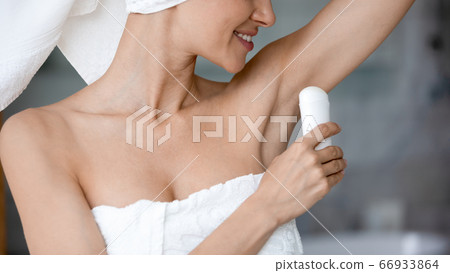 Young woman take care of armpit use dry antiperspirant 66933864