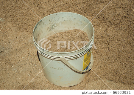 Plastic bucket with sand in a construction site at Castelo de Vide Plastic bucket with sand in a construction site at Castelo de Vide 66933921