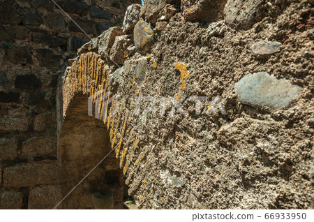 Stone arch in wall on the historical city center of Castelo de Vide 66933950