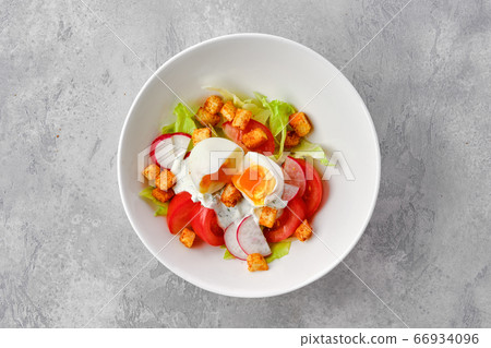 Salad with tomato, radish, egg and crouton Salad with tomato, radish, egg and crouton 66934096