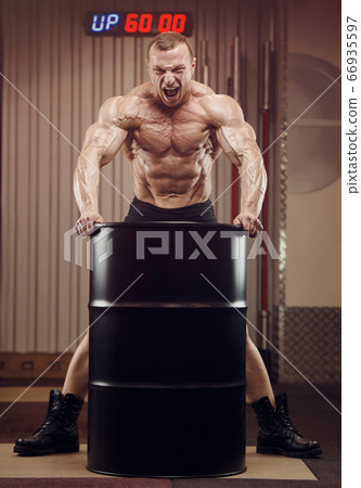 Bodybuilder athletic man workout muscles exercise 66935597