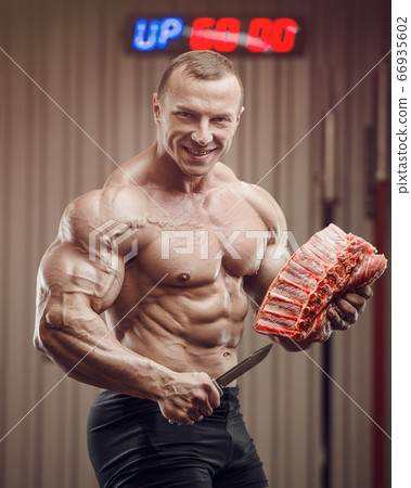 Fitness man at workout in gym Fitness man at workout in gym 66935602