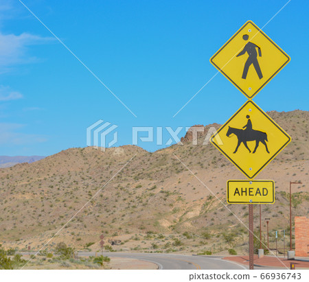 Pedestrians and Horse Riding Ahead Sign, in Bullhead, Mohave County, Arizona USA Pedestrians and Horse Riding Ahead Sign, in Bullhead, Mohave County, Arizona USA 66936743