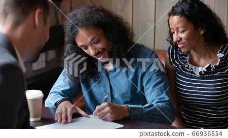 African couple sign contract document closing deal with realestate agent 66936854