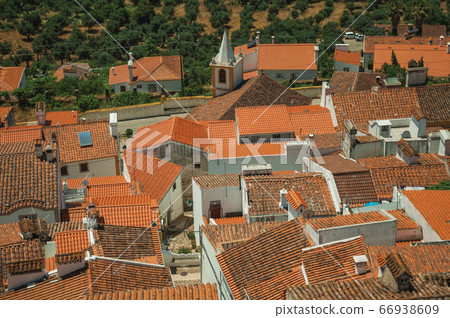 Cityscape with many rooftops and steeple at Castelo de Vide Cityscape with many rooftops and steeple at Castelo de Vide 66938609