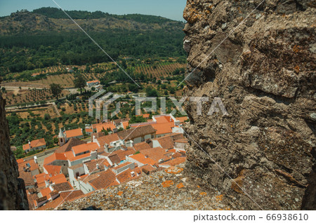 Cityscape with roofs seen by crenel at Castelo de Vide Cityscape with roofs seen by crenel at Castelo de Vide 66938610