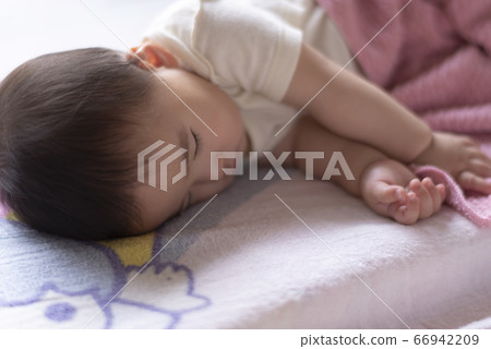 Baby who is taking a nap 66942209