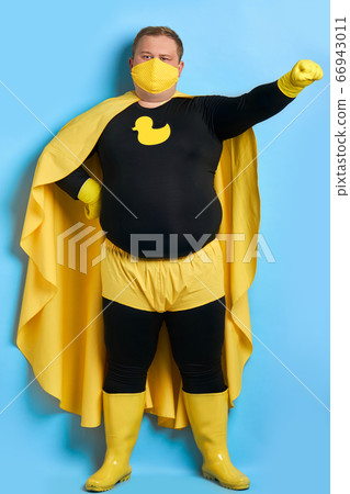 caucasian fat cleaning man in costume of superhero 66943011
