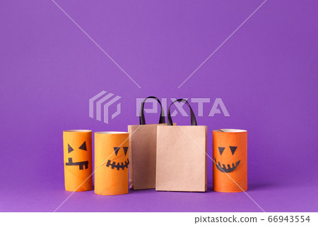 Autumn season Halloween holiday sale concept - toy from toilet roll tube? recycle idea and paper cragt shoppin bag on purple background, eco-friendly easy diy, flyer, coupon 66943554