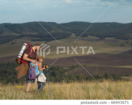 Father and daughter travel in nature - looking at view. 66943671