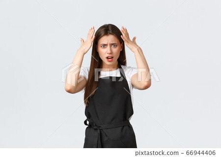 Grocery store employees, small business and coffee shops concept. Freaked-out frustrated barista complaining, staring shocked and disappointed. Saleswoman having argument 66944406