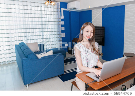 Telework image of a young woman working from home Telework image of a young woman working from home 66944769