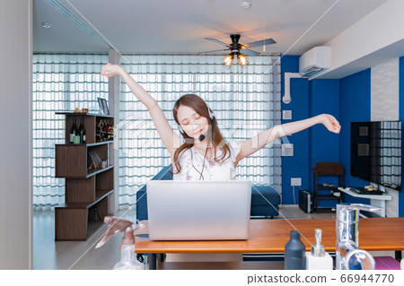 Telework image of a young woman working from home 66944770