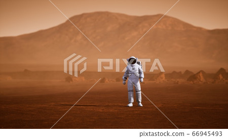Astronaut on Mars Surface. Red Planet Covered in Astronaut on Mars Surface. Red Planet Covered in 66945493