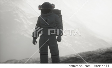 astronaut on another planet with dust and fog astronaut on another planet with dust and fog 66945511