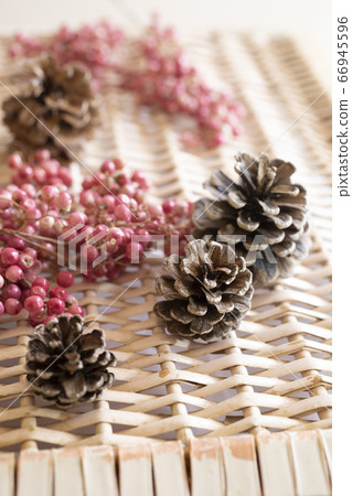 An antique autumn/winter image with pine cones and pepperberries An antique autumn/winter image with pine cones and pepperberries 66945596
