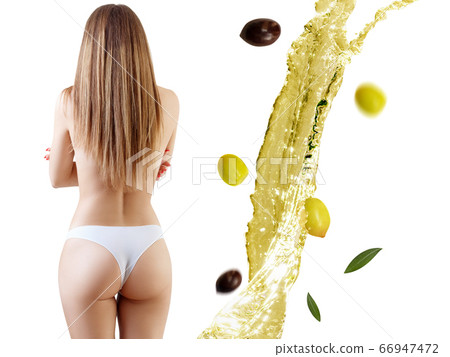 Back view on female body near olive oil splash. Back view on female body near olive oil splash. 66947472