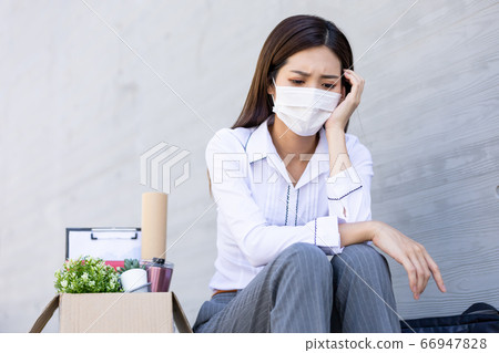 Asian woman is laid off 66947828