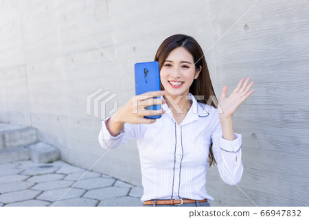 Asiian businesswoman has video chat 66947832