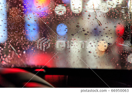 Raindrops on the windshield 66950063