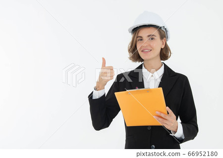 Portrait of a woman in hard hat and suit looking Portrait of a woman in hard hat and suit looking 66952180