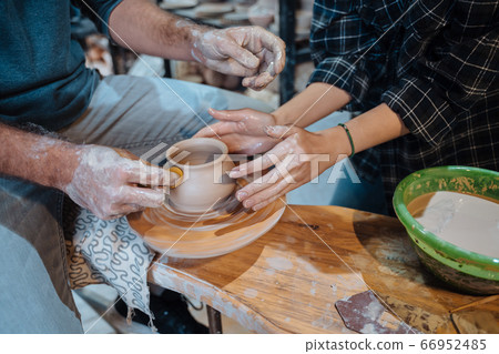 Making a handmade clay pot. Pottery lesson, hobby. 66952485