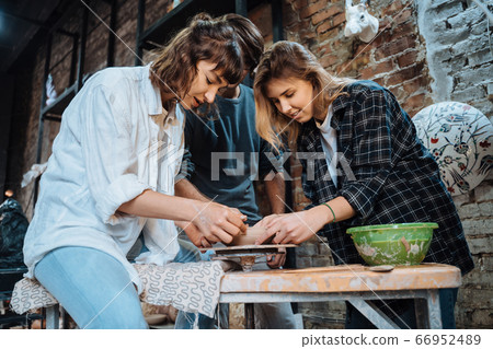Making a handmade clay pot. Pottery lesson, hobby. 66952489
