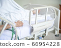 Hand of elder Asian woman patient on bed in 66954228