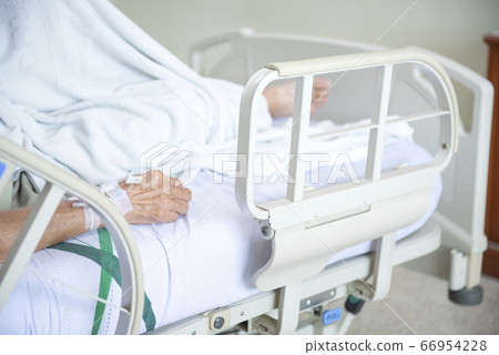 Hand of elder Asian woman patient on bed in Hand of elder Asian woman patient on bed in 66954228