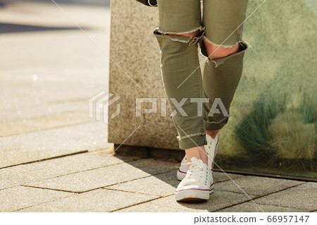 Legs wearing trousers and sneakers Legs wearing trousers and sneakers 66957147
