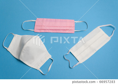 Three colored reusable medical masks, isolated Three colored reusable medical masks, isolated 66957283