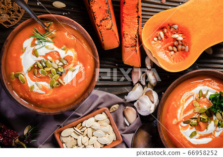 Flat lay view at homemade rustic pumpkin soup with Flat lay view at homemade rustic pumpkin soup with 66958252