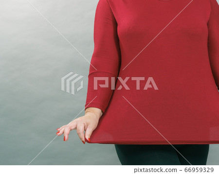 Woman plus size in red tunic 66959329