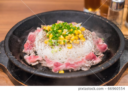 pork with rice on hot pan 66960554