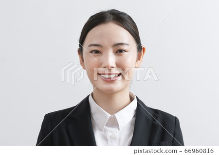 Young woman in a suit looking at camera 66960816