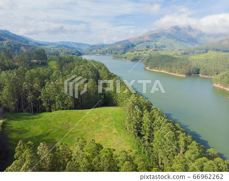 Aerial view beautiful nature with mountains and hills by Lake Mattupetty. Kerala State. Near the city of Munar. 66962262
