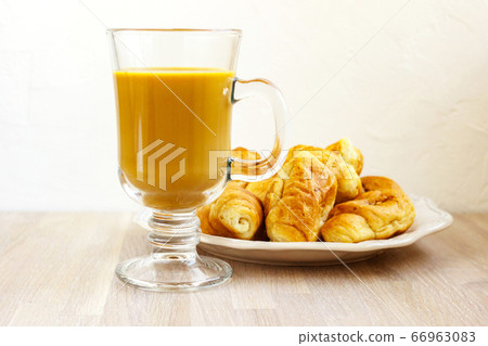 Milk coffee gluss cup and white plate of Milk coffee gluss cup and white plate of 66963083