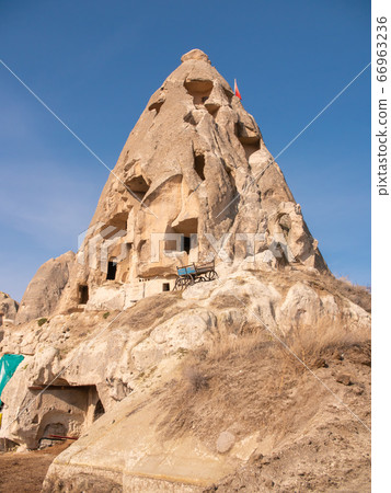 Volcanic mountain with windows near the city of Goreme in Turkey. Cappadocia. 66963236