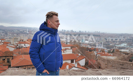 A tourist looks at the panorama of Ankara, the capital of Turkey. 66964172