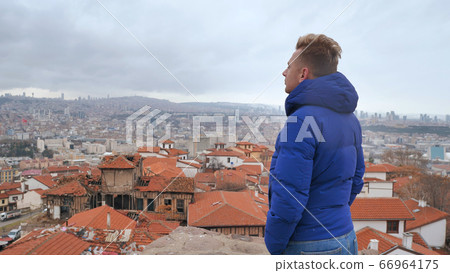 A tourist looks at the panorama of Ankara, the capital of Turkey. A tourist looks at the panorama of Ankara, the capital of Turkey. 66964175